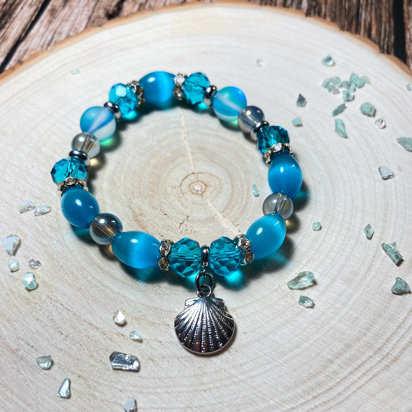 B24-48 - Blue & Silver Stretch Bracelet w/ Shell Charm