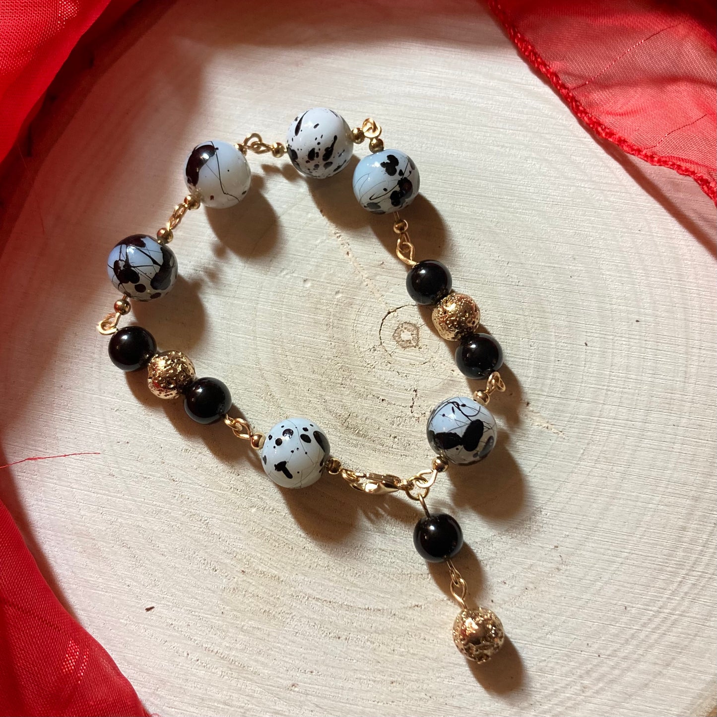B24-F70C - Black, White and Gold Bracelet