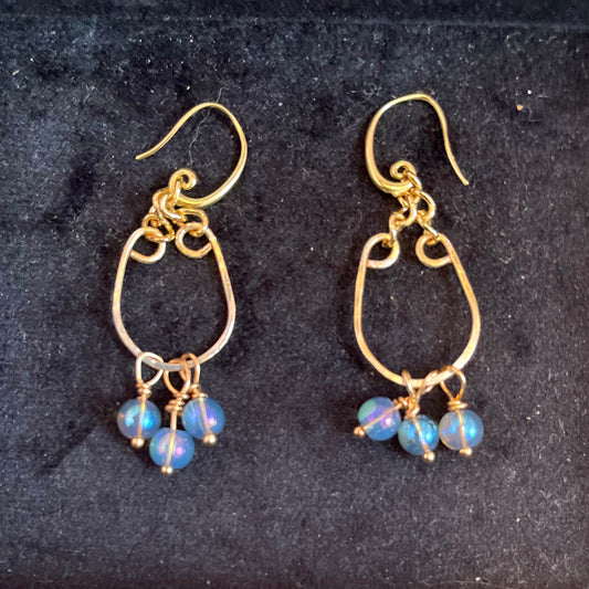 25E 20  Curved gold earrings with blue accents