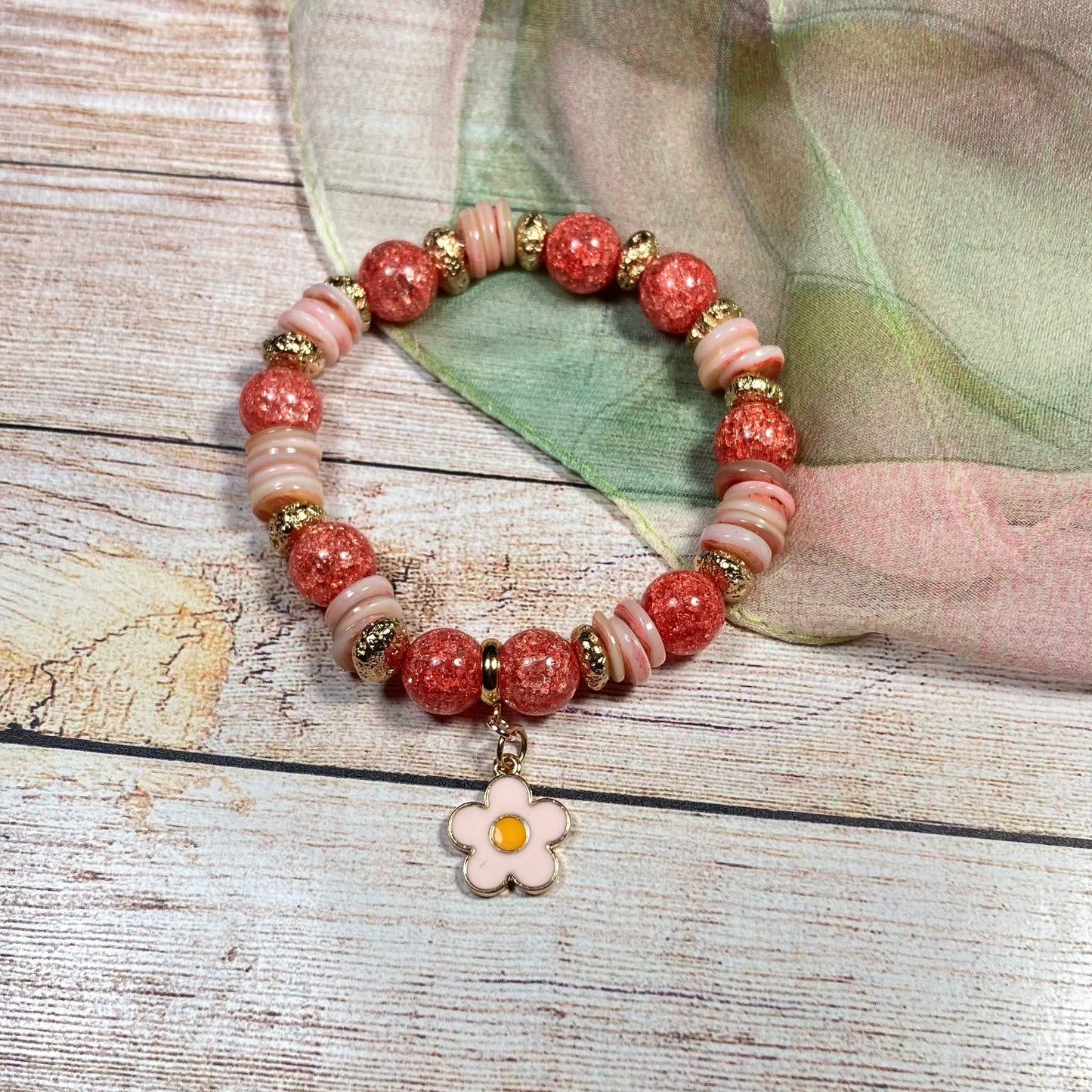 B24-44 - Peach & Red-Orange Stretch Bracelet w/ Flower Charm