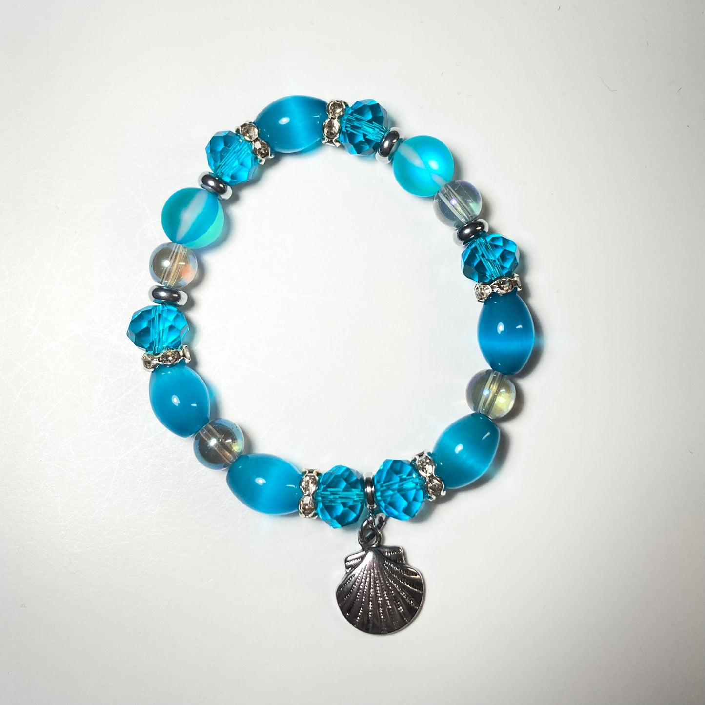 B24-48 - Blue & Silver Stretch Bracelet w/ Shell Charm