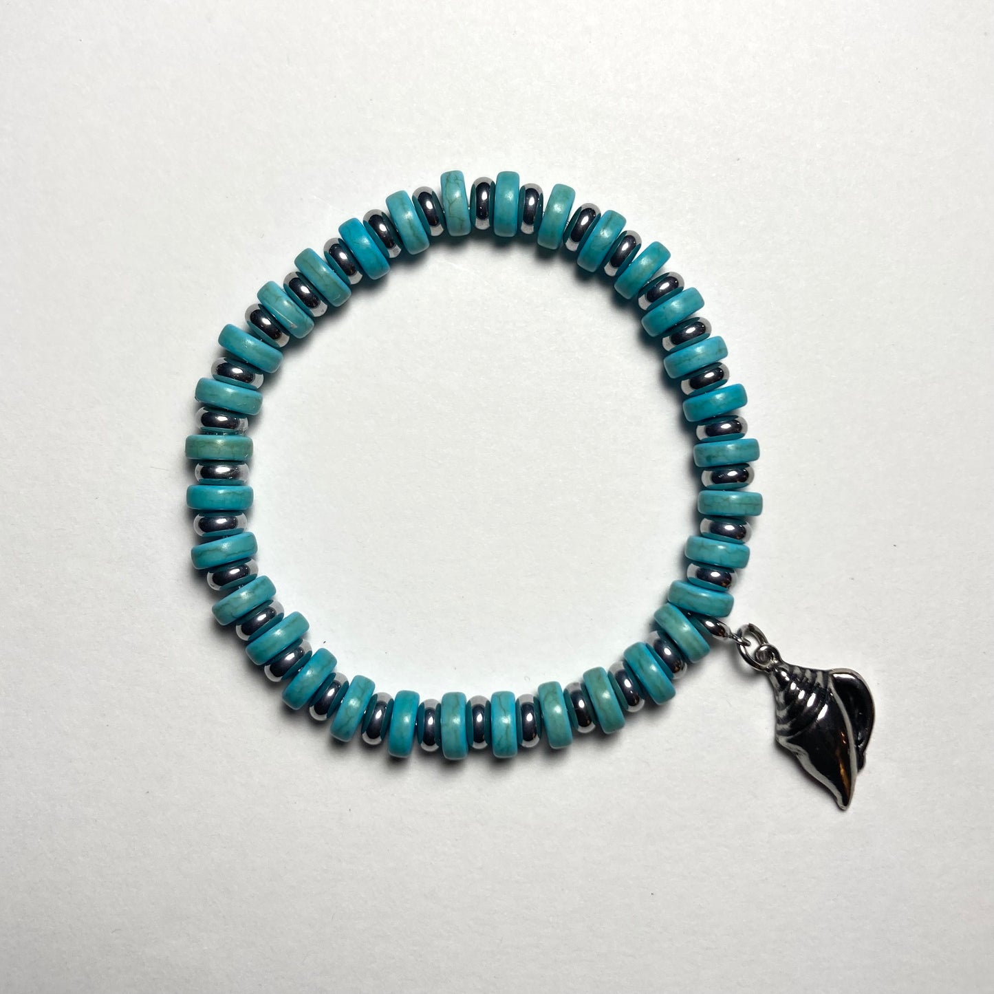 B24-F62 - Turquoise and Silver Stretch Bracelet with Shell Charm