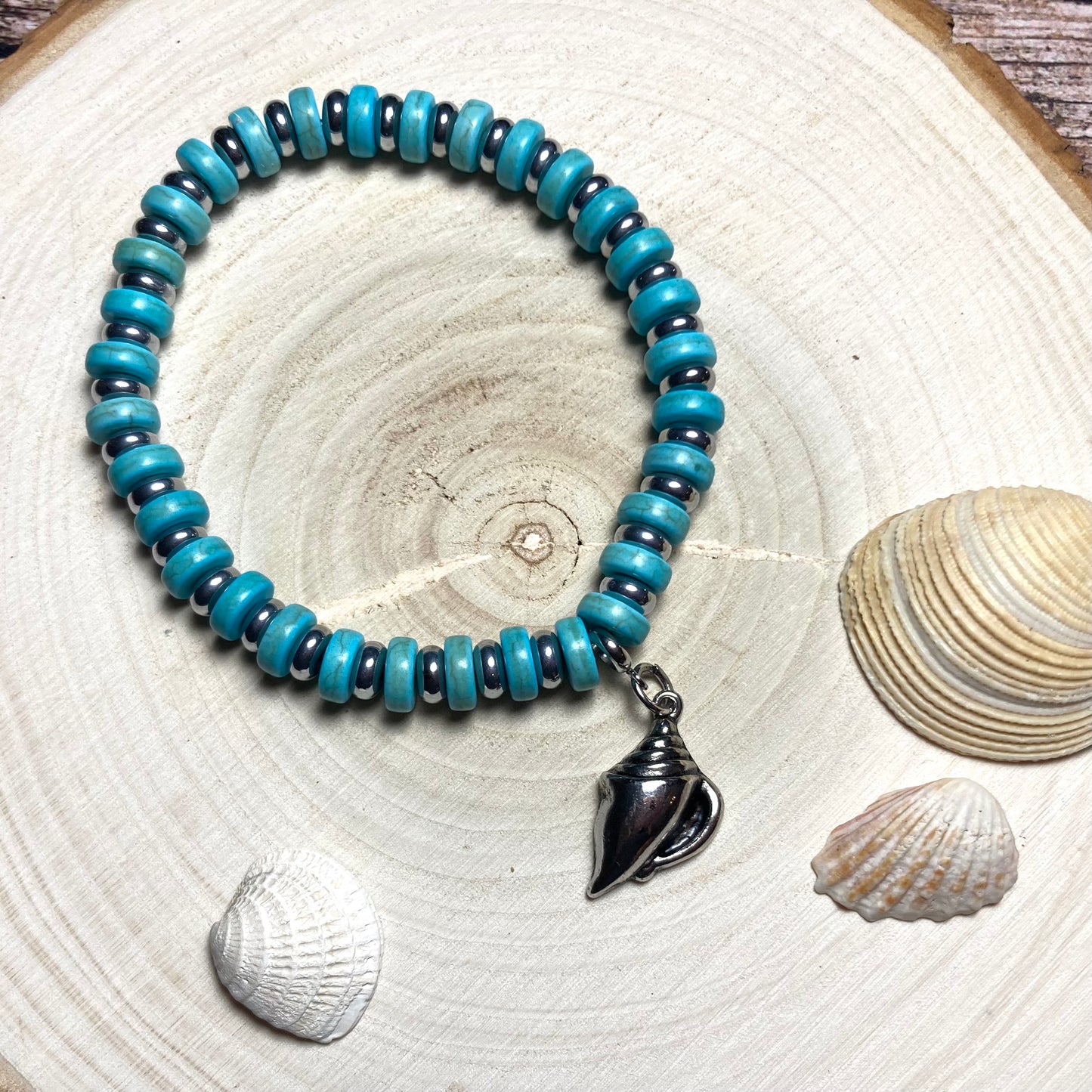 B24-F62 - Turquoise and Silver Stretch Bracelet with Shell Charm