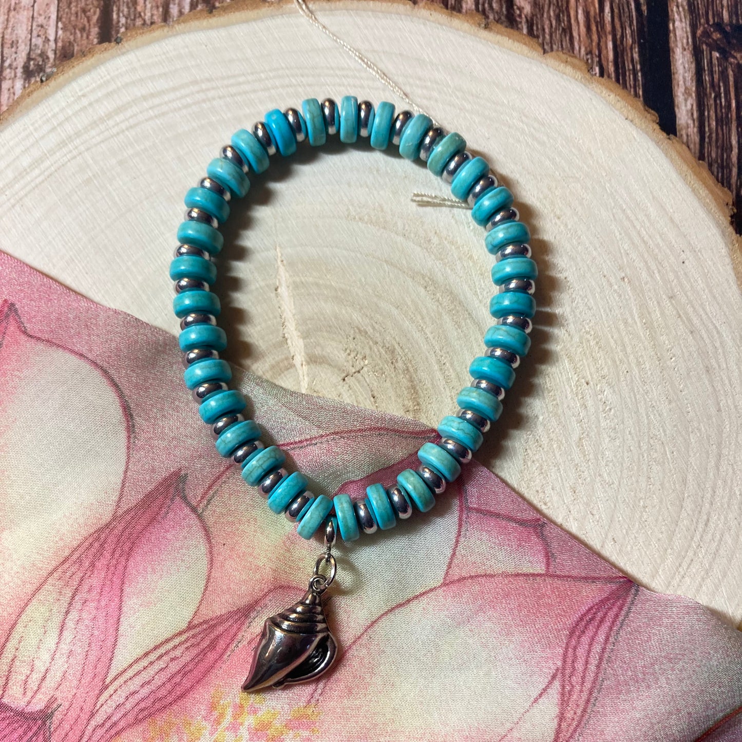 B24-F62 - Turquoise and Silver Stretch Bracelet with Shell Charm