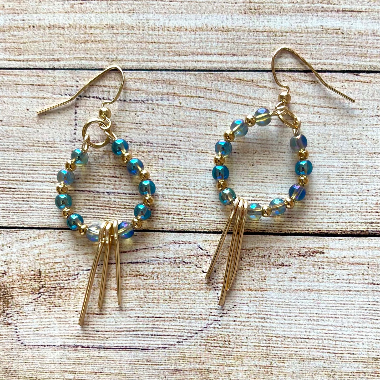 25 E26  Pretty sky blue beaded hoops with fringes