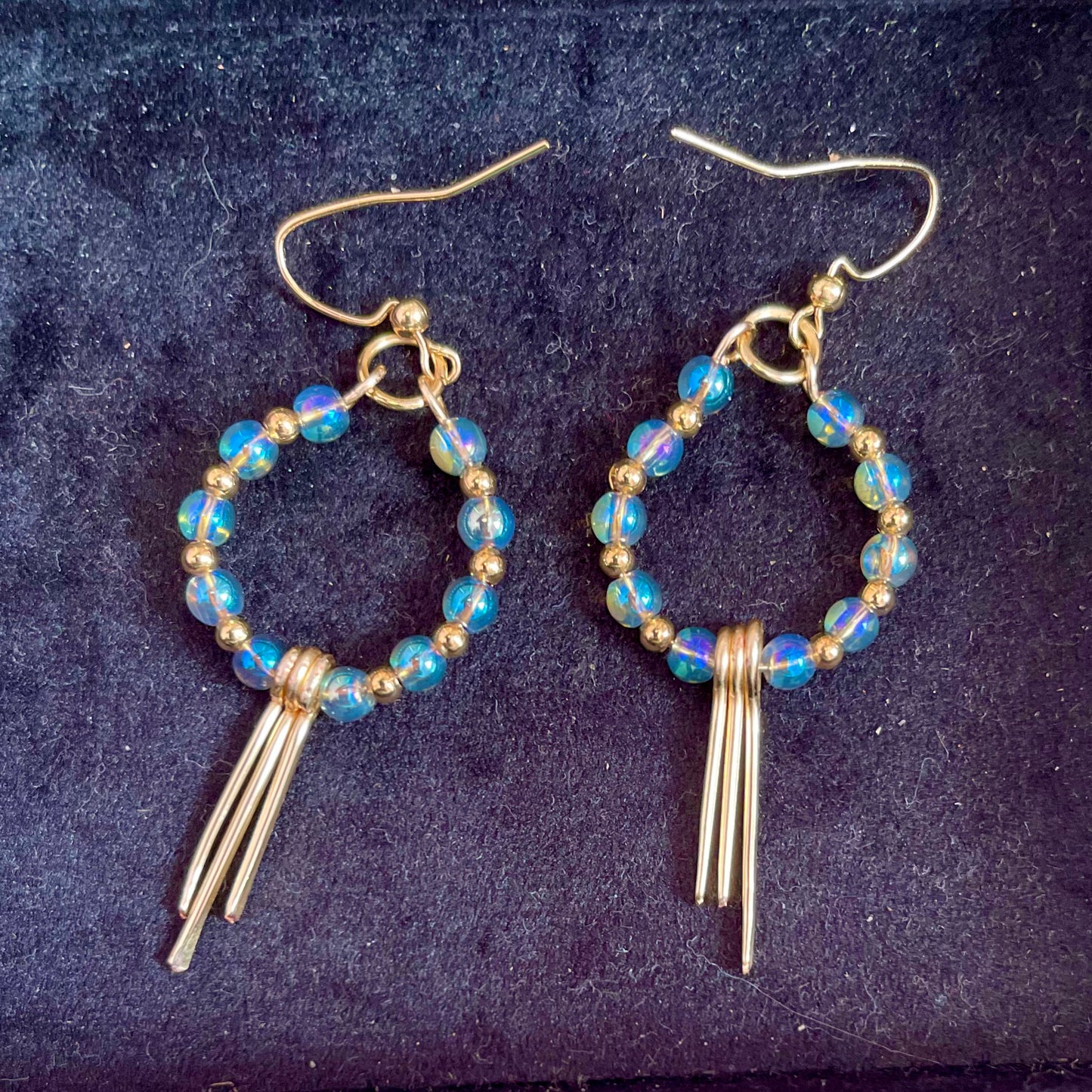 25 E26  Pretty sky blue beaded hoops with fringes