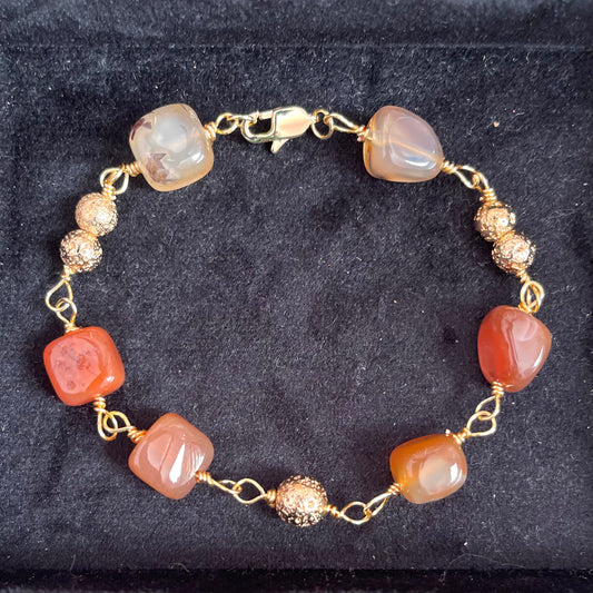 25 B25  Gold linked with red stones