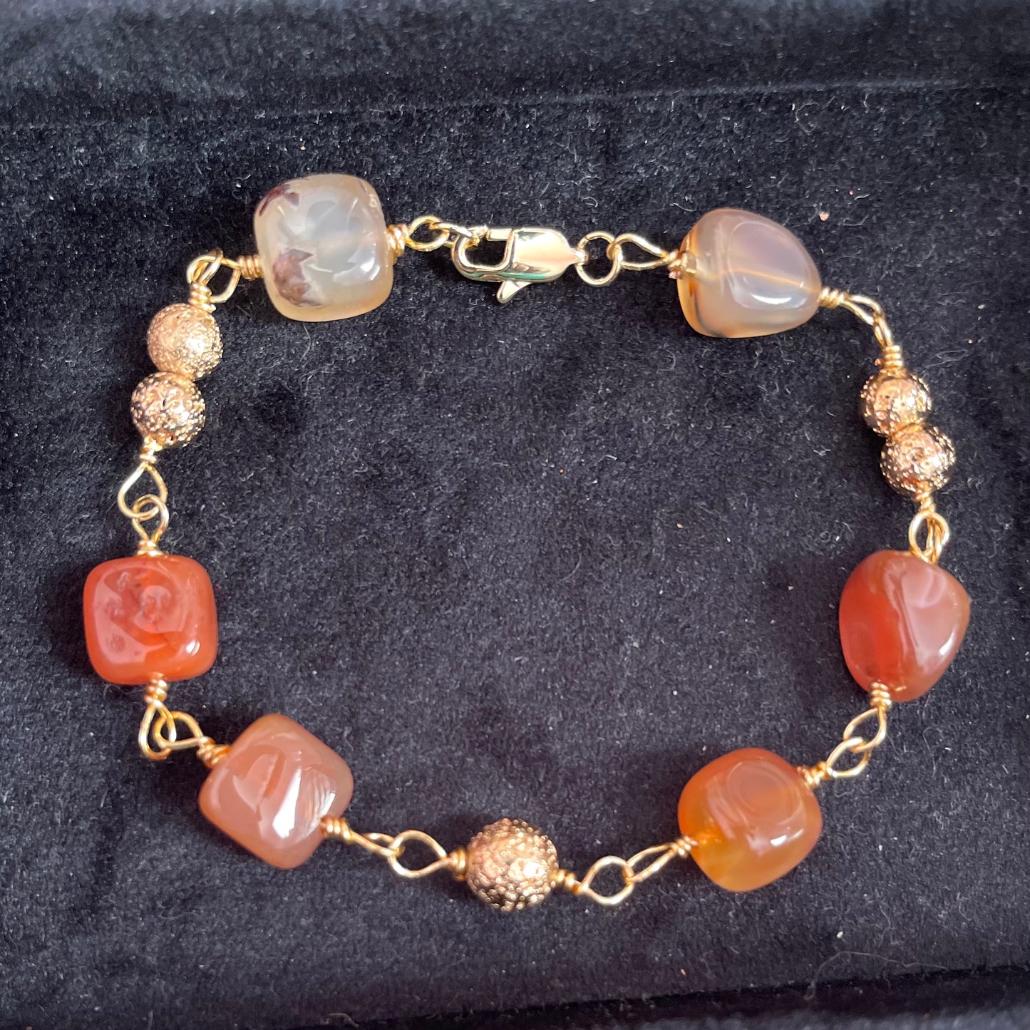 25 B25  Gold linked with red stones