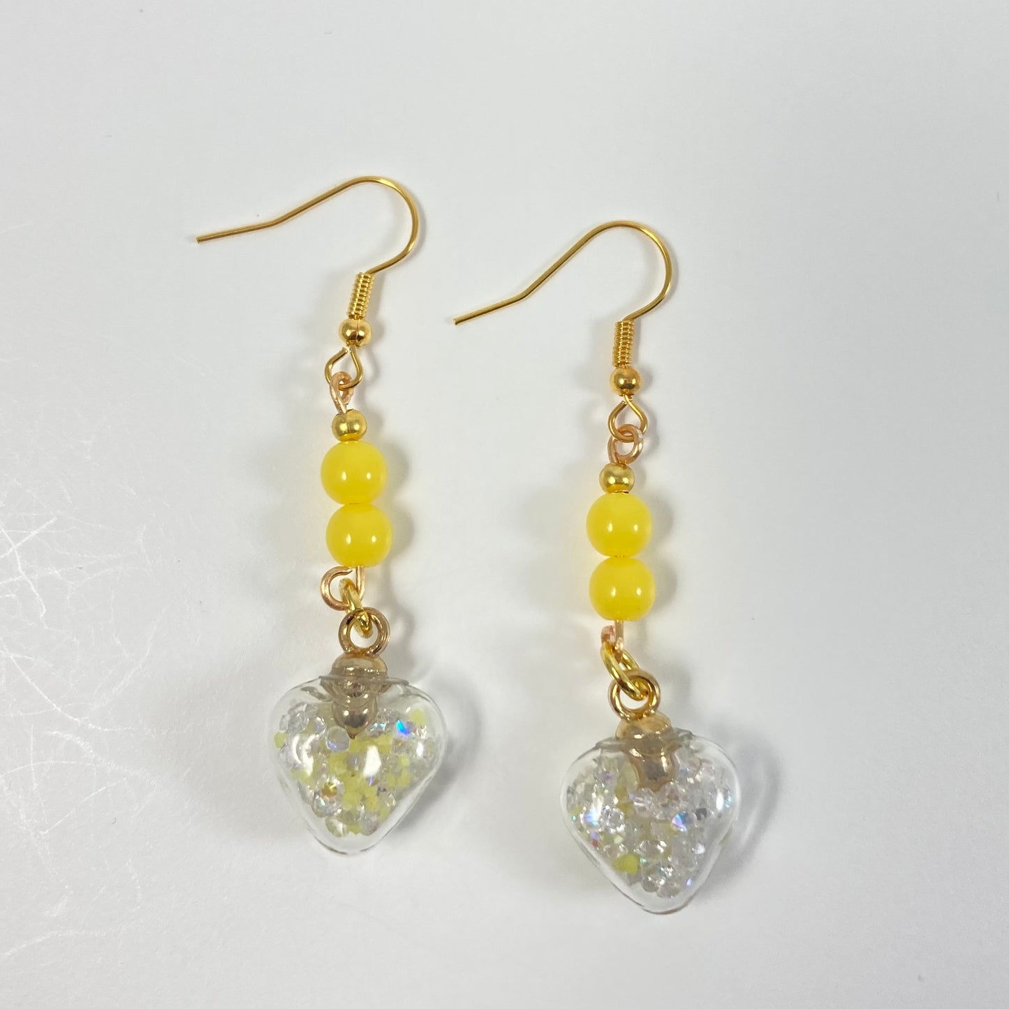 E24-FH6 - Clear & Yellow Glow in the Dark Heart Earrings