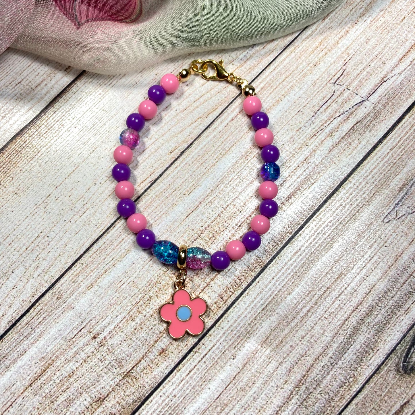 GB24-50 - Pink & Purple Beaded Bracelet w/ Flower Charm